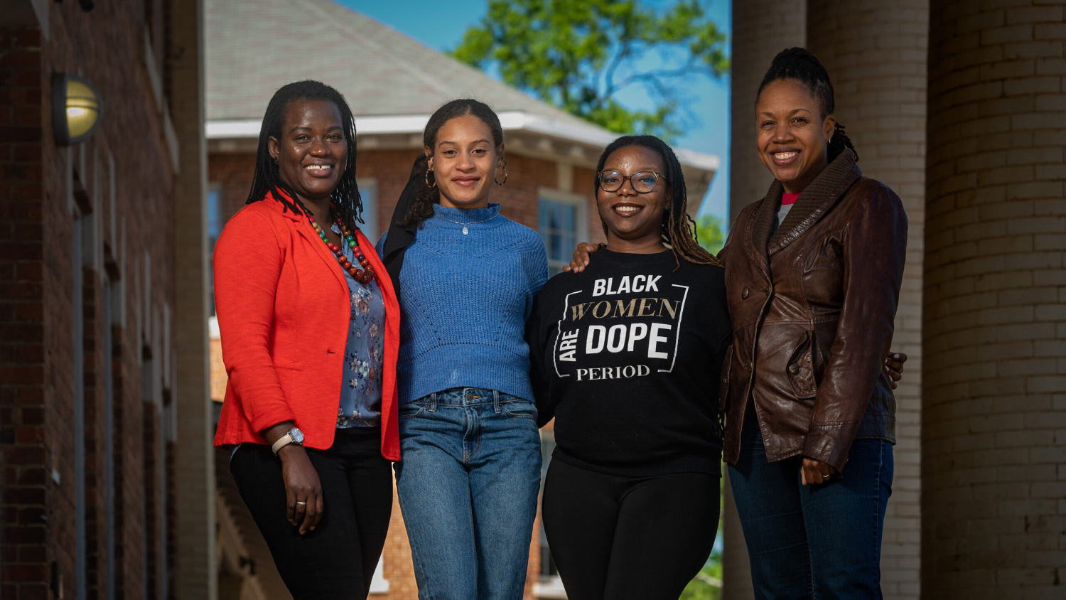 Haddy Njie, Kayla Clark, Ariana Frazier and Natalie Bullock-Brown in front of the 1911 Building.
